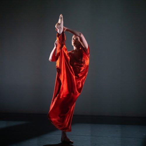 Dancer raising her leg above her head